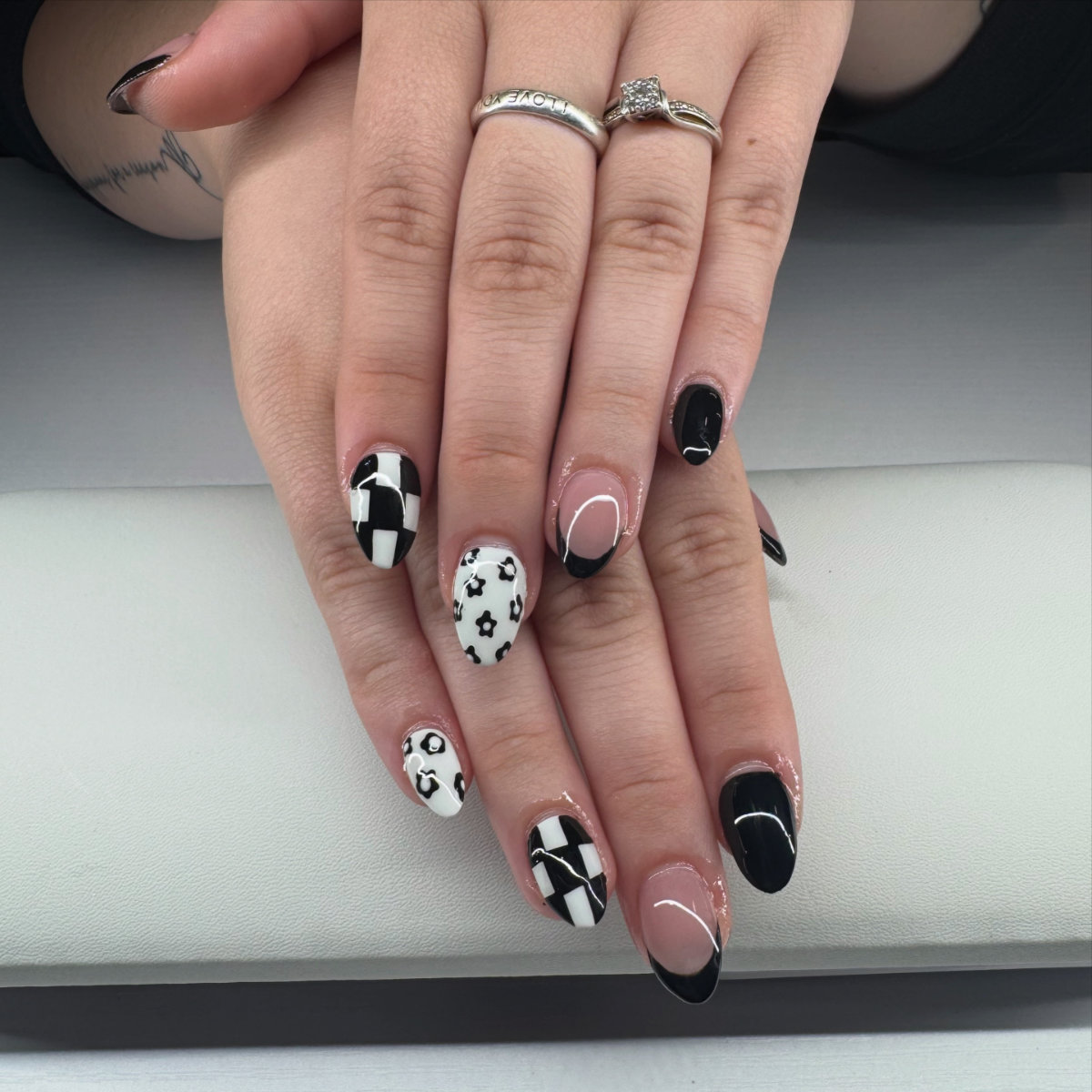 Black and white manicure with nail art at Nails by the gracie g in waterford ohio